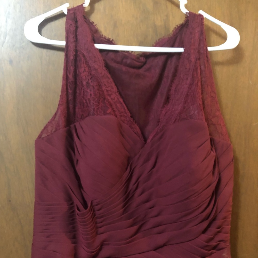 Long burgundy dress with lace straps and part of back. V neckline. Size 18